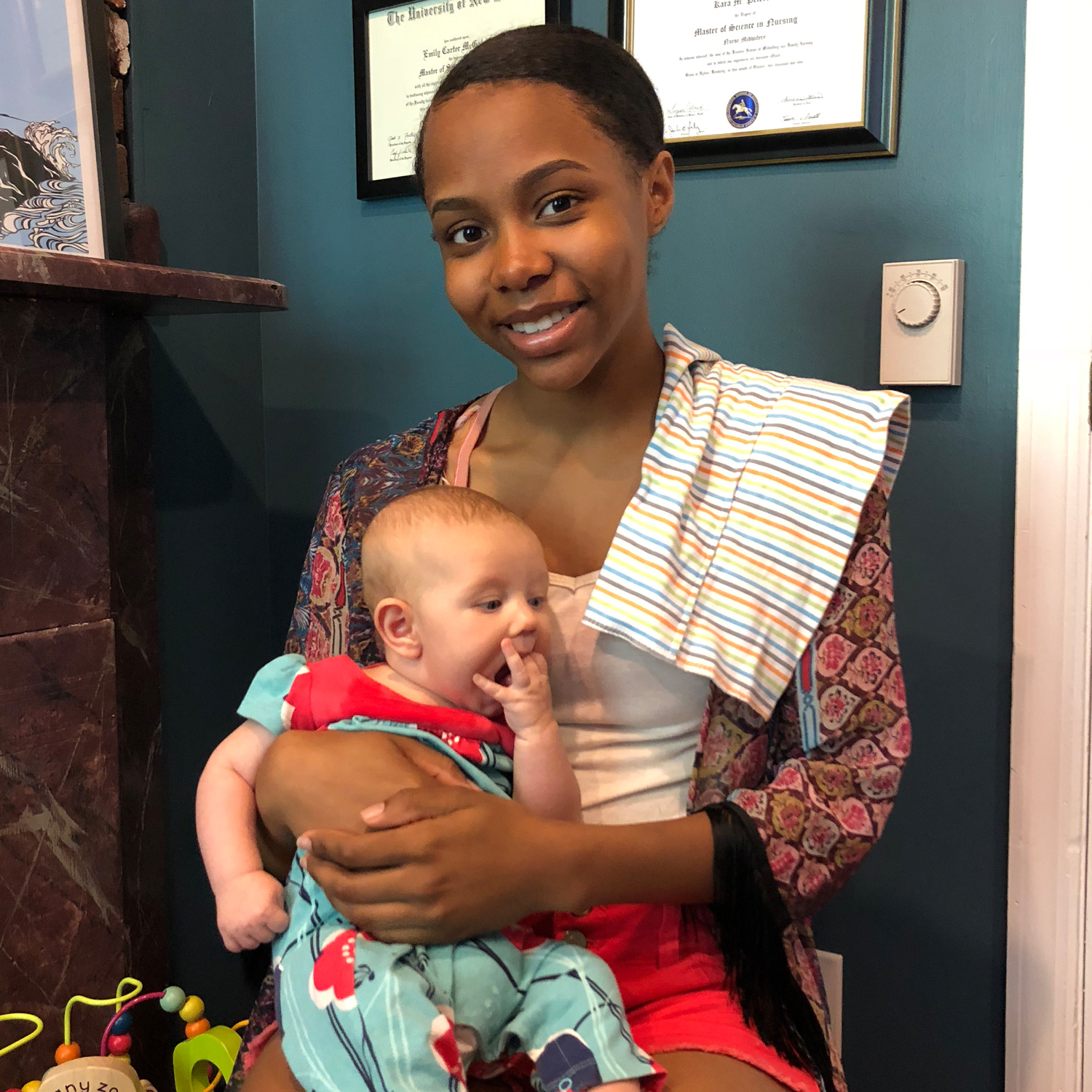 High school student holding baby at The Midwife Center