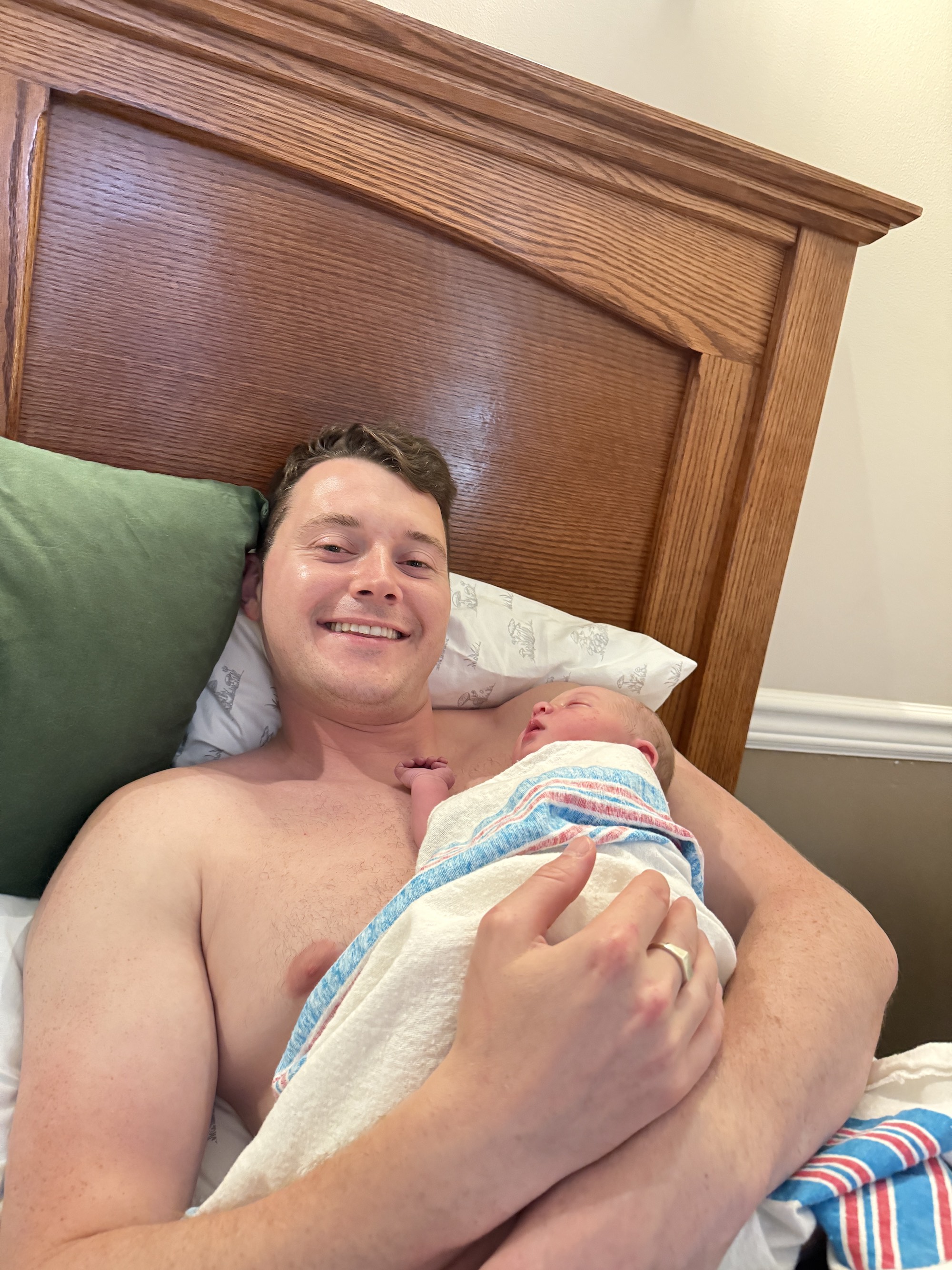 Finn holds Helena for skin-to-skin contact after birth.